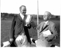 Men Holding a Trophy Cup