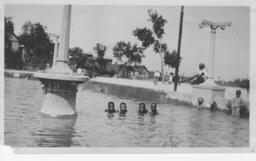 Boys Swimming in a Fountain