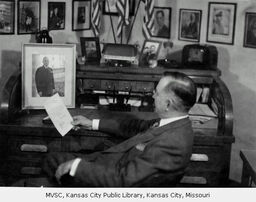 N. Emerson Paton Seated at Desk