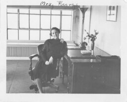 Woman Seated at Desk