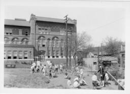 First Grade Students Working In Garden at Woodland School