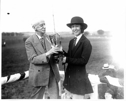 Equestrian Rider Receiving a Trophy