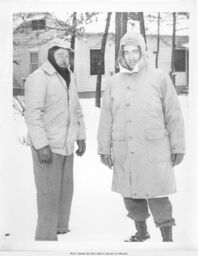 Two Men Standing in Snow