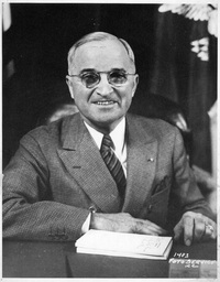 President Harry S. Truman Seated at Desk