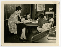 Teacher and Children in Classroom of an Unidentified School