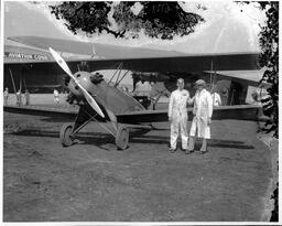 Two Men Beside a Plane