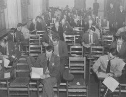 Men Taking an Exam