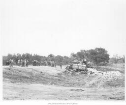 Men Standing in Landfill