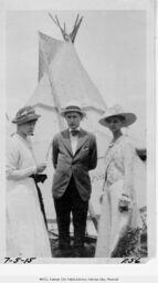 Women and Man In Front of Teepee