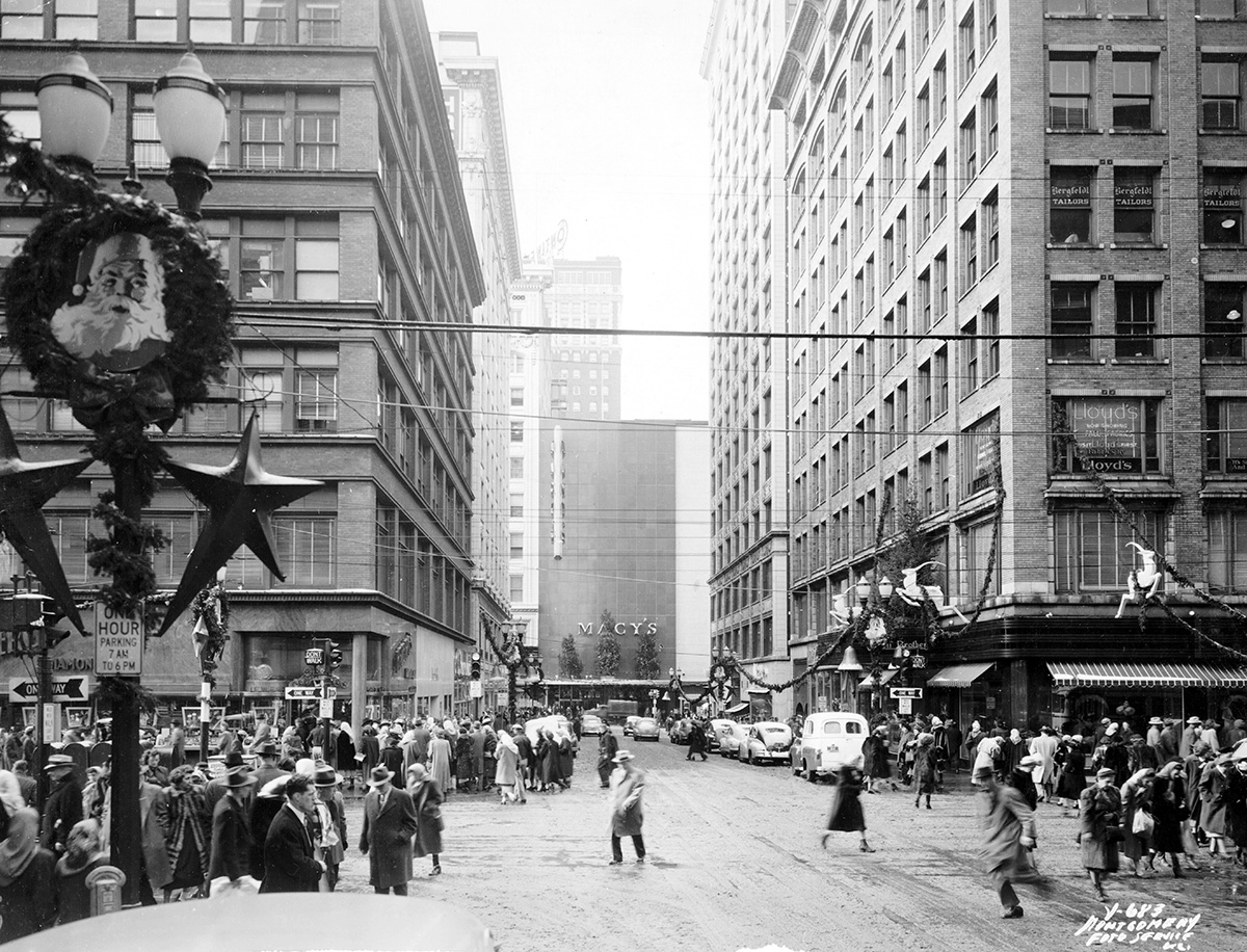 View looking west along 11th Street from Walnut Street. The section known as Petticoat Lane is outfitted with Christmas decorations.