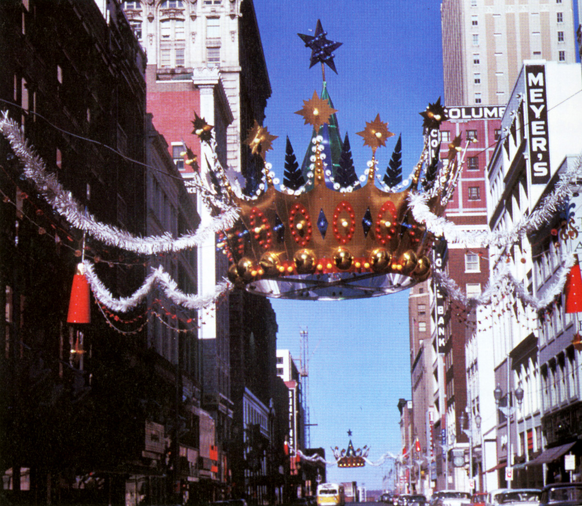 Christmas crown suspended above a busy downtown Kansas City intersection