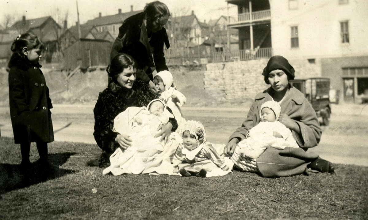 Women and children wait for a Well Baby Clinic, ca. 1925.