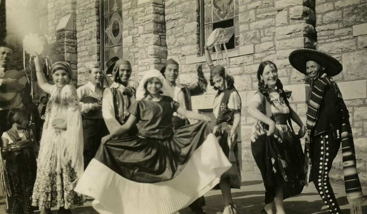 Dancers and musicians pose in front of Our Lady of Guadalupe Catholic Church, ca. 1930.