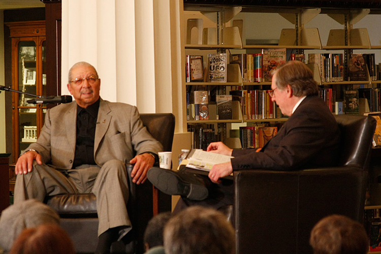 Ollie Gates discussing his experiences in the barbecue restaurant business with Crosby Kemper III at a Central Library event.