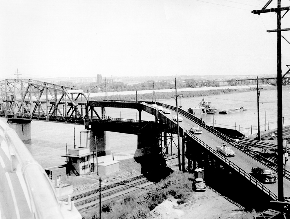 Automobiles crossing the upper deck of the Hannibal Bridge.