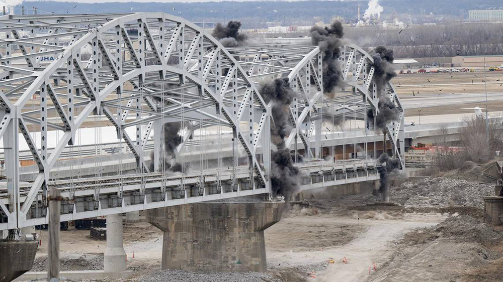 A blast takes out the first arch on Feb. 15, 2024. THE KANSAS CITY STAR