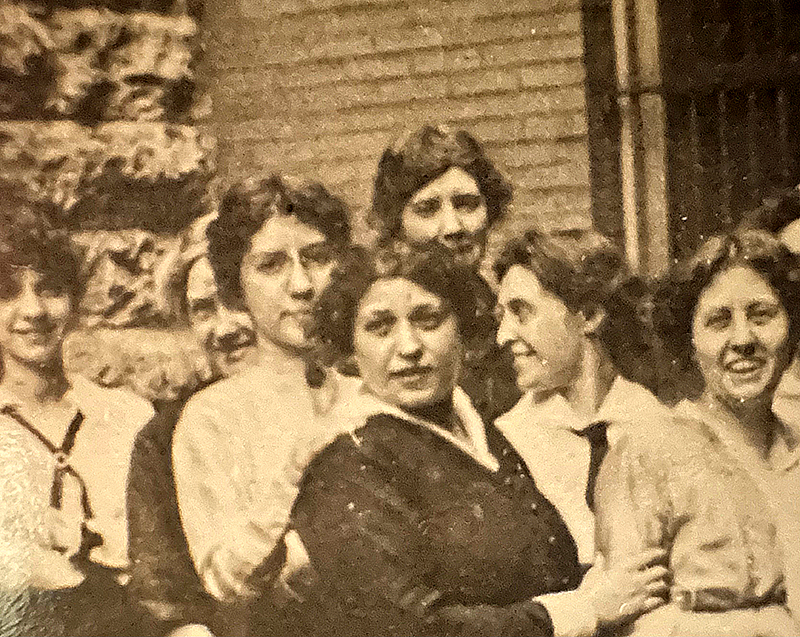 Fannie and Carrie (second and third row from the right) pose for a group portrait outside the library at Ninth and Locust streets, ca. 1900.