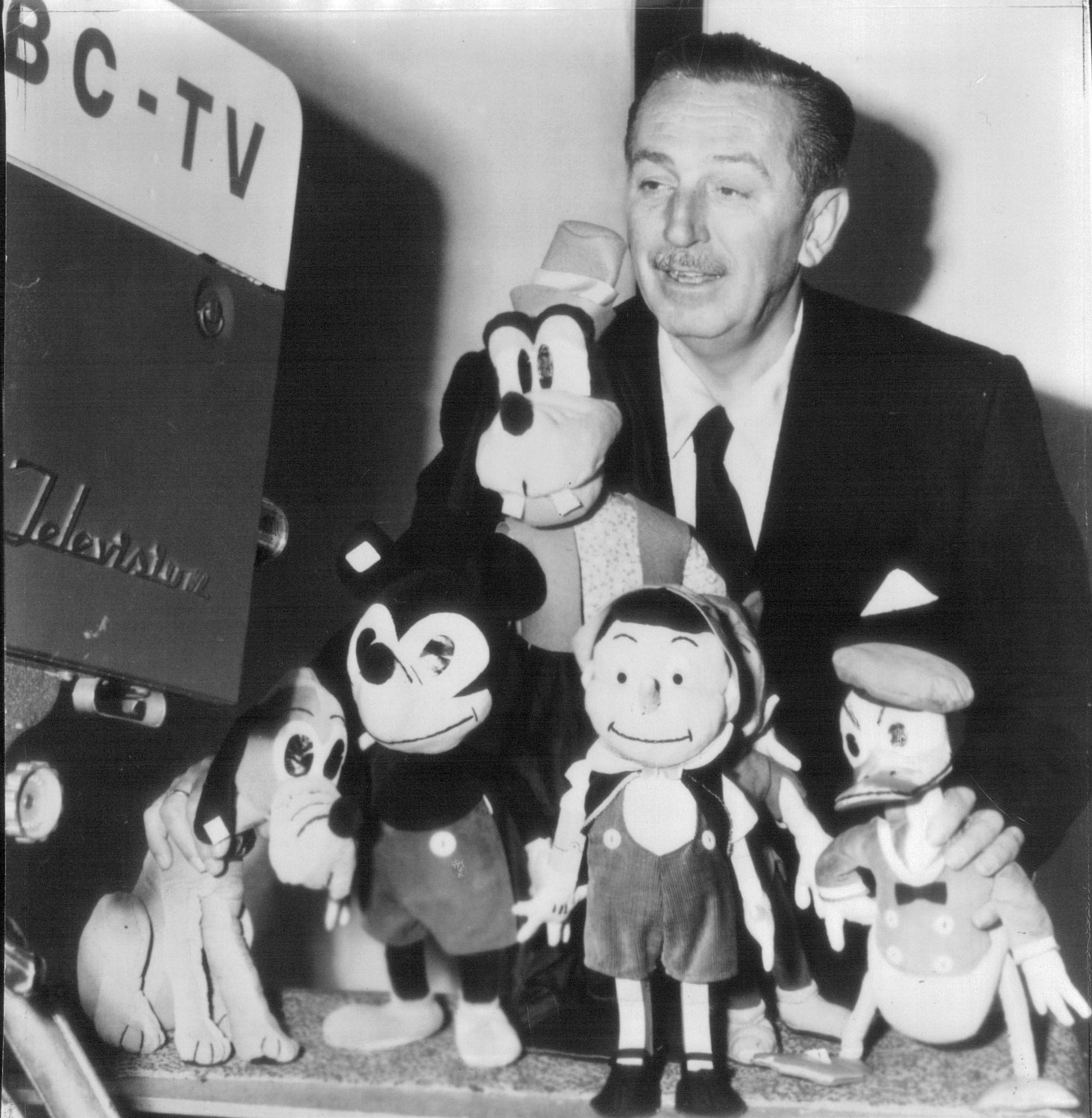 Walt Disney posing with some of his characters in 1954. FILE/The Kansas City Star