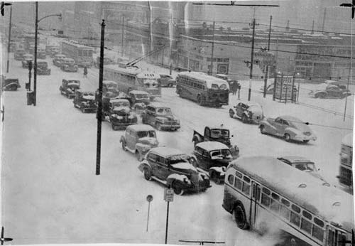 a busy city street in a snow storm