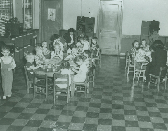 young children sitting in a classroom