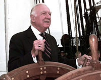 Walter Cronkite takes the helm of the USS Constitution 21 July 1997.