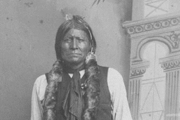 Apache chief Dor-con-each-la in traditional dress