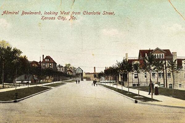 Color illustrated postcard of a street scene