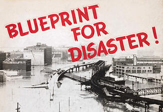 Photo of a city with the text "Blueprint For Disaster!" overlaid